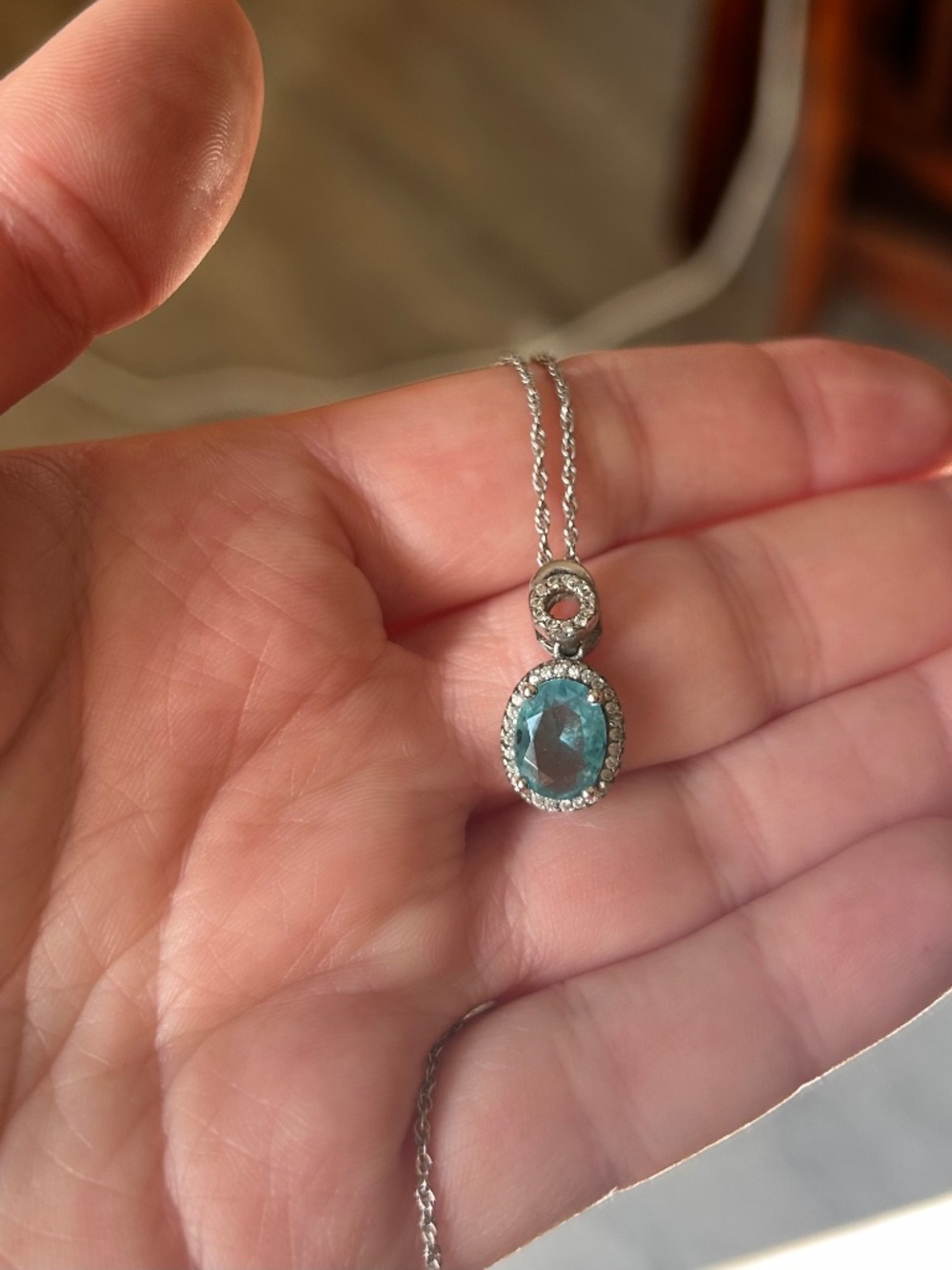 Sterling silver pendant with a blue topaz